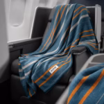 Elevating Cabin Luxury Why Premium Woven rPET Blankets Beat Cheap Fleece Throws