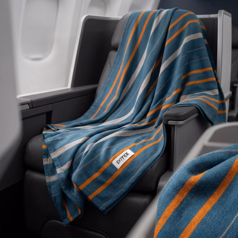 Elevating Cabin Luxury Why Premium Woven rPET Blankets Beat Cheap Fleece Throws
